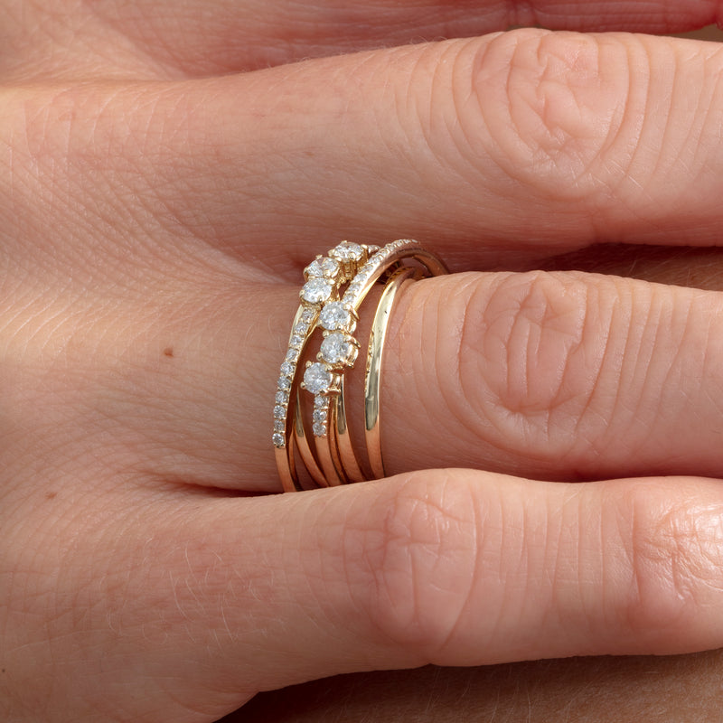 gold diamond bands in criss cross design with natural white diamonds