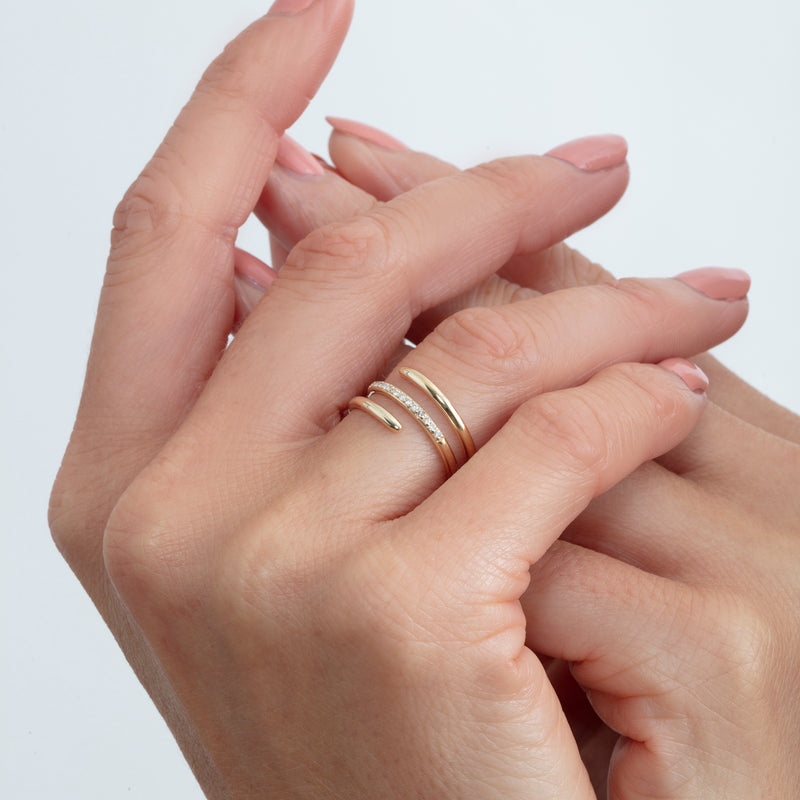 spiral ring in 14k gold with pave diamond accents 