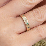 engraved celestial ring with emerald and diamond accents 