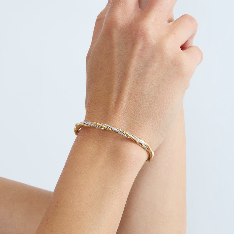 statement bangle in twist design and ribbed texture with natural white diamonds 