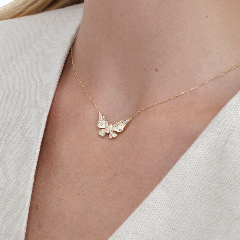 handcrafted gold butterfly pendant necklace with flush set diamonds 