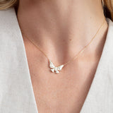 butterfly pendant necklace with flush set diamonds in 14k gold 