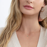 dainty emerald bezel stacking necklace for may birthstone in 18k gold 