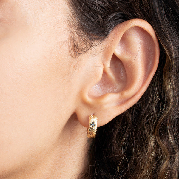 14k gold engraved hoop earring with black diamonds