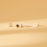 Pair of solid 14k gold black diamond bezel stud earrings