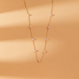 Classic and elegant natural pearl station necklace for timeless style.