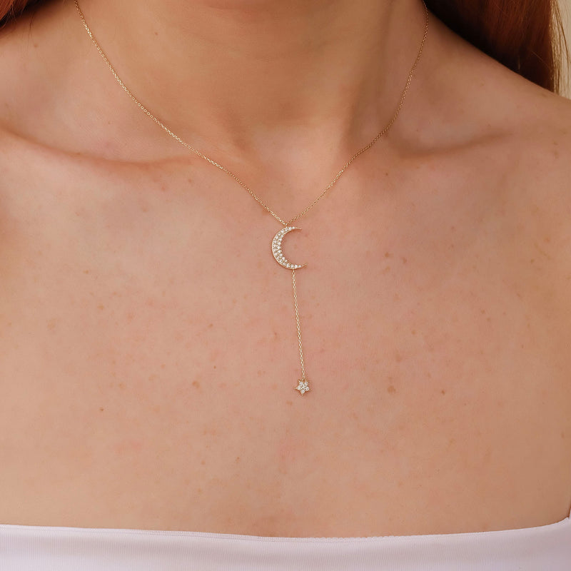 minimalist lariat necklace in solid gold with moon and star