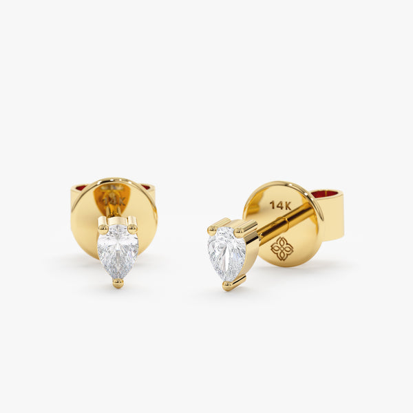 handmade pair of solid 14k gold pear cut diamond stud earrings 