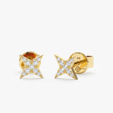 handmade pair of solid 14k gold in north star shape stud earrings with paved diamonds