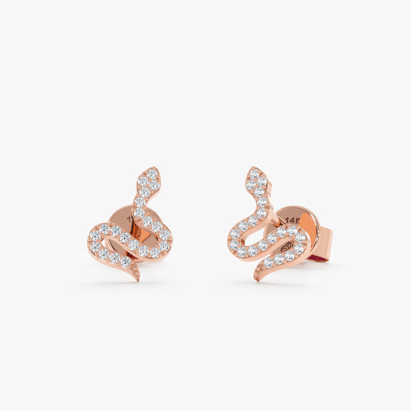 Pair of handmade solid 14k rose gold snake stud earrings with diamonds 