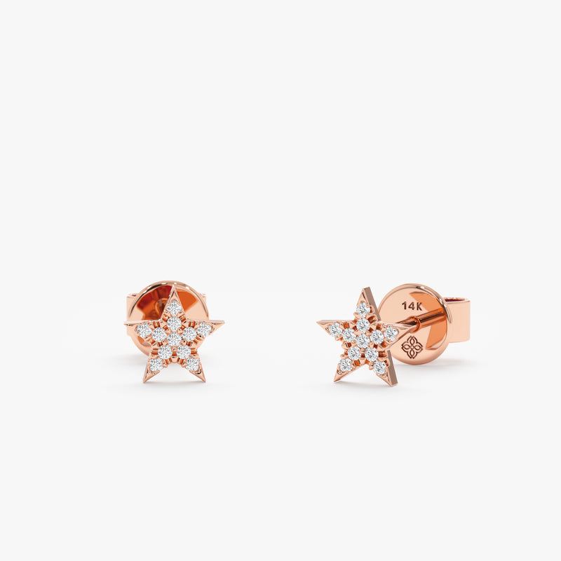 handmade pair of solid 14k rose gold star stud earrings with paved diamonds
