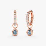 Pair of aquamarine pear cut stone charm huggies lined in diamonds made of 14k solid rose gold