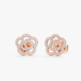 handmade pair of solid 14k rose gold rose shape stud earrings lined in diamonds 