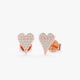 handmade pair of solid 14k rose gold stud earrings in long heart shape with paved diamonds