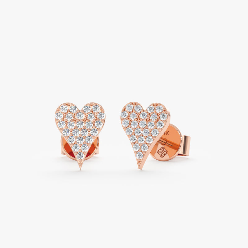 handmade pair of solid 14k rose gold stud earrings in long heart shape with paved diamonds