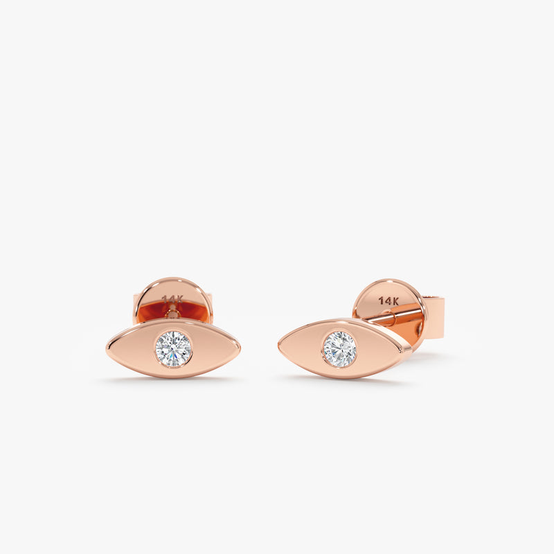 Pair of handmade solid 14k rose gold stud earrings in eye shape with single diamond