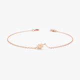 Protective hamsa hand bracelet with diamond detail crafted in solid rose gold.