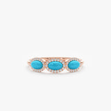 14k rose gold ring with three turquoise stones and diamond halo for december birthstone