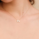 Celebrate a special bond with this solid gold boy and girl pendant necklace.