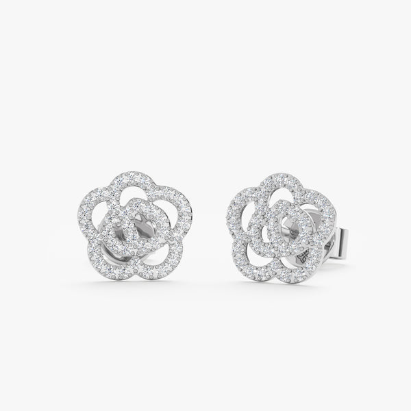 handcrafted pair of solid 14k white gold rose stud earrings with paved diamonds 