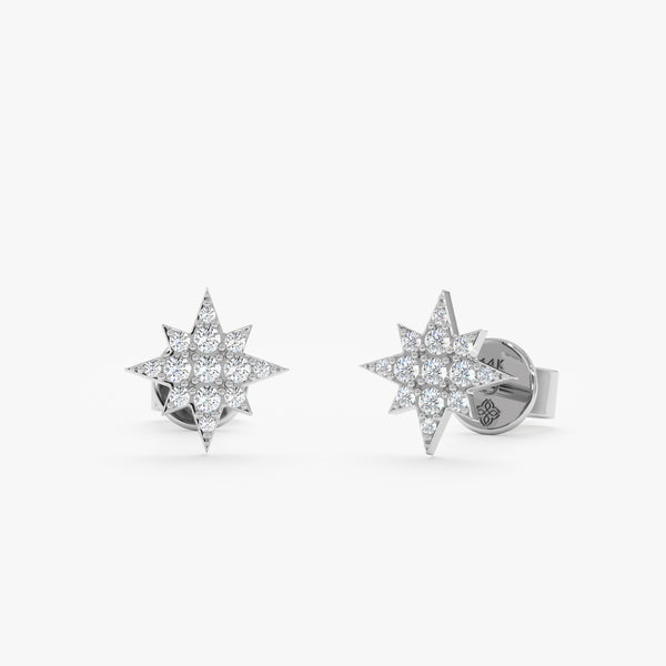 handcrafted pair of solid 14k gold starburst star stud earrings with paved diamonds