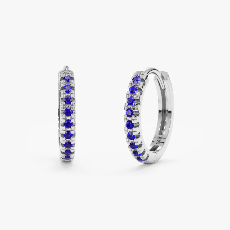 Solid 14k white gold hoop huggies with lined blue sapphires