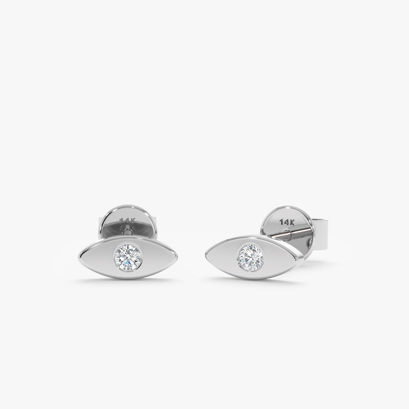 Pair of handmade solid 14k white gold eye stud earrings with single diamond