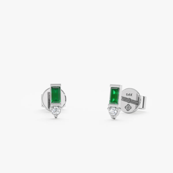 handcrafted pair of solid white gold baguette emerald stud earrings with diamond