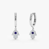 Pair of handmade 14k solid white gold hamsa hand charm huggie with diamonds and blue sapphire