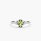 oval cut peridot engagement ring with milgrain bezel in 14k white gold