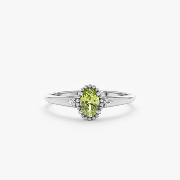 oval cut peridot engagement ring with milgrain bezel in 14k white gold