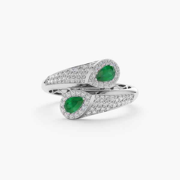 14k white gold wrap around ring with two emeralds and paved diamonds