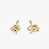 Pair of handmade solid 14k yellow gold snake stud earrings with natural white diamonds