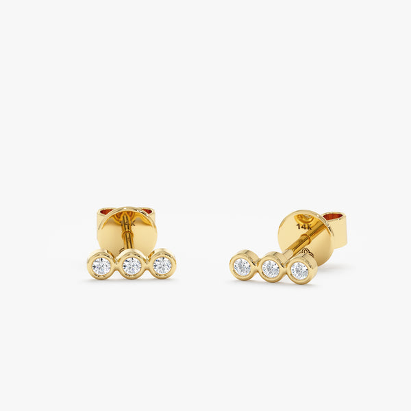 Handmade pair of solid 14k gold three bezel diamond stud earrings