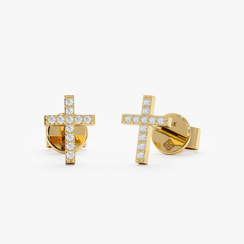 handmade pair of solid 14k gold cross stud earrings with lined diamonds