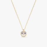 Solid gold happy face pendant with diamond smile and blue sapphire eyes on a gold chain.