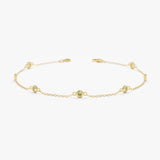 yellow gold peridot station bracelet