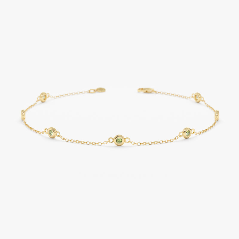 yellow gold peridot station bracelet