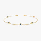 blue topaz bezel station bracelet in solid gold 