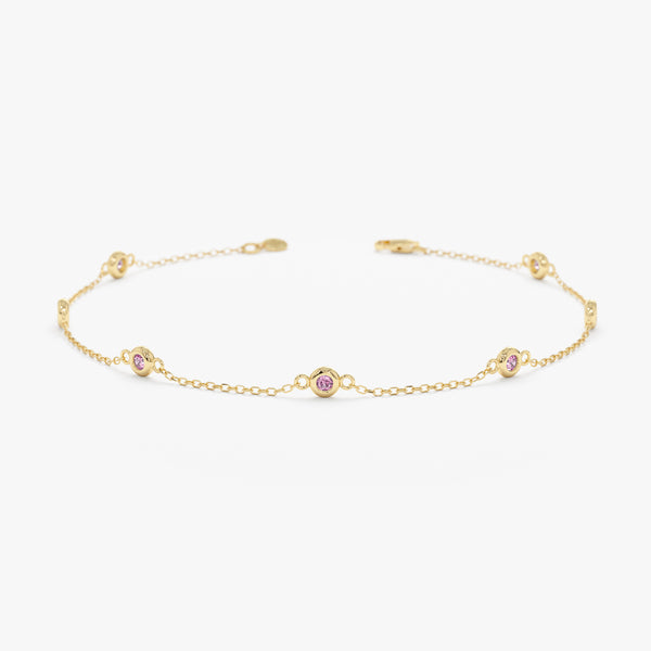 solid gold pink sapphire station bracelet