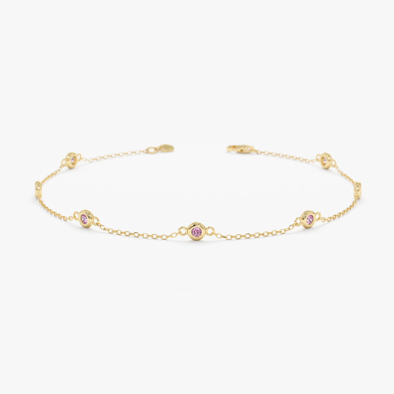 solid gold pink sapphire station bracelet