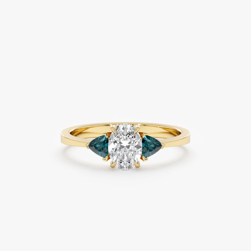 white diamond ring with trillion cut teal sapphires in solid gold