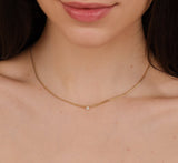 dainty cuban chain necklace with single white diamond bezel