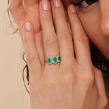 handmade engagement ring with emeralds and diamonds