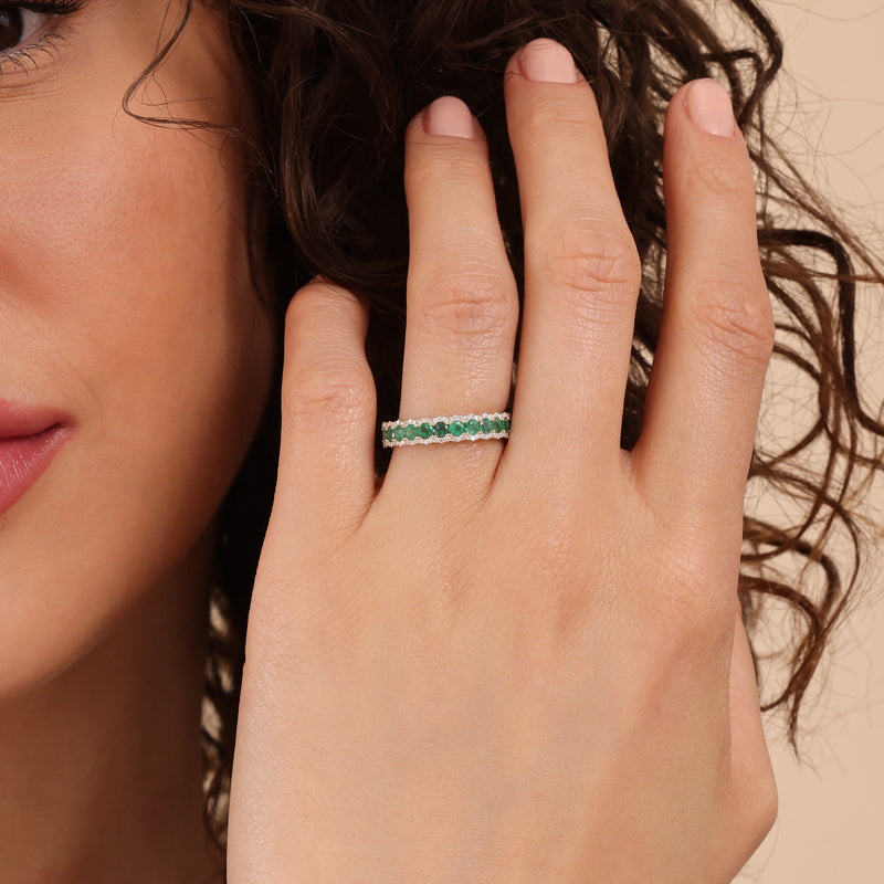 round cut emeralds and diamonds in handcrafted in solid gold band