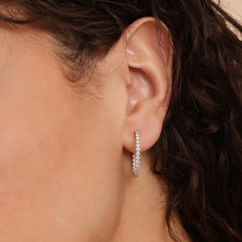 bold hoop earrings with round cut clear diamonds