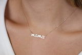 The perfect personalized gift: a custom cursive name necklace in solid gold.