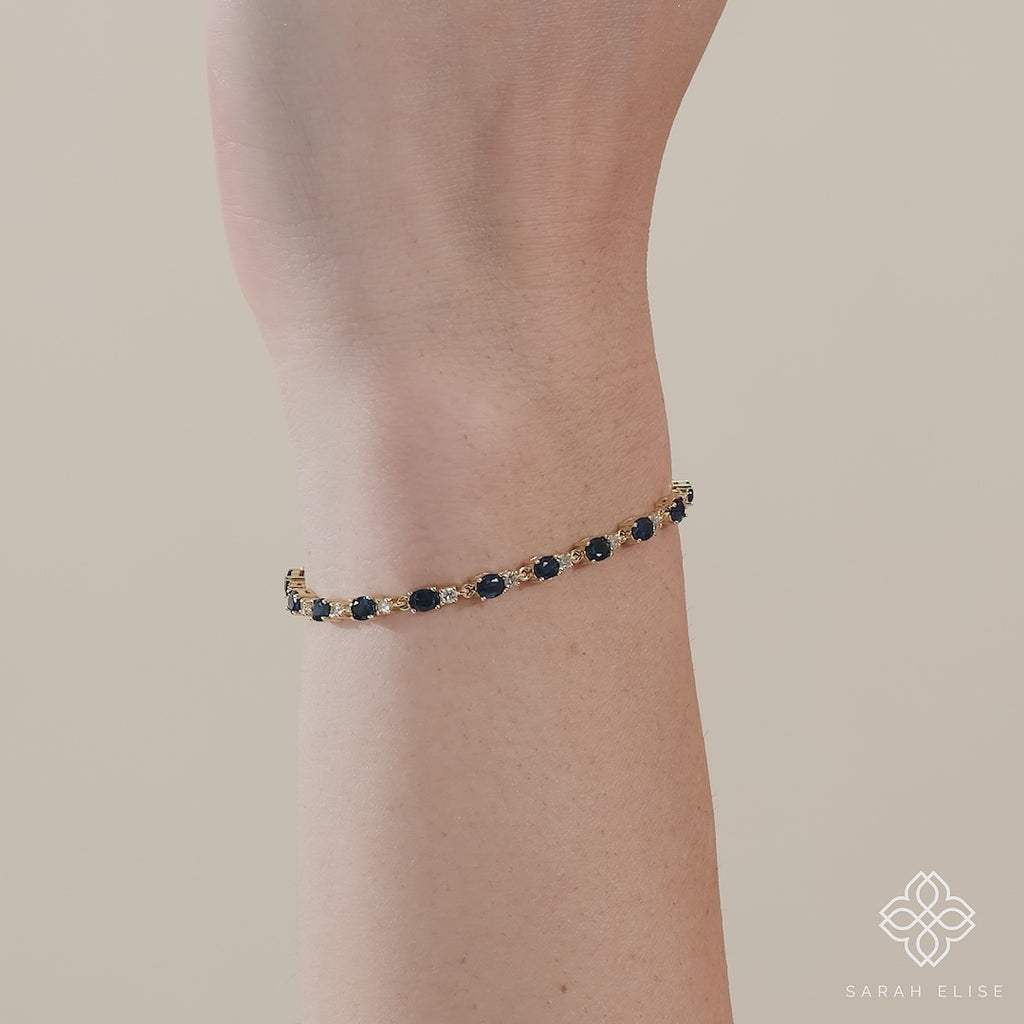 Sparkling sapphires and diamonds adorn this elegant garland bracelet.
