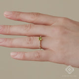 ethically sourced green peridot and white diamond engagement band