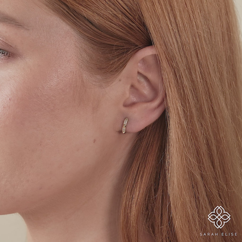 Video close up of 14k spiked diamond ear hoop huggie